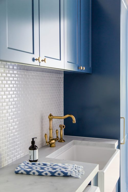 Feature navy laundry cabinetry